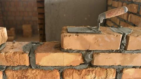 Brickwork of brick, folded in a certain way and fixed with mortar. industrial Stock Photos