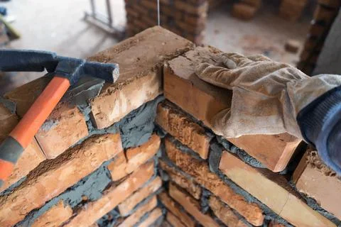 Brickwork of brick, folded in a certain way and fixed with mortar. industrial Stock Photos