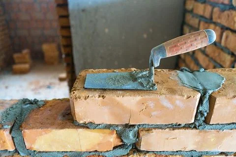 Brickwork of brick, folded in a certain way and fixed with mortar. industrial Stock Photos