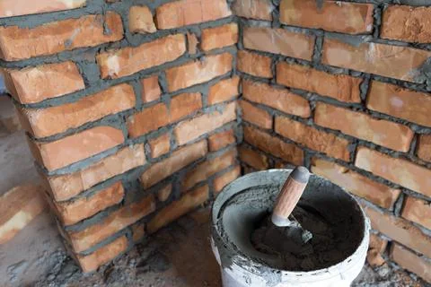 Brickwork of brick, folded in a certain way and fixed with mortar. industrial Stock Photos