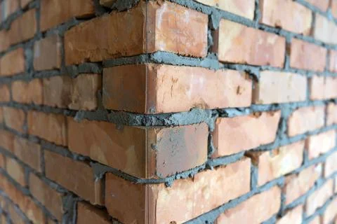 Brickwork of brick, folded in a certain way and fixed with mortar. industrial Stock Photos