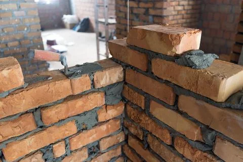 Brickwork of brick, folded in a certain way and fixed with mortar. industrial Stock Photos