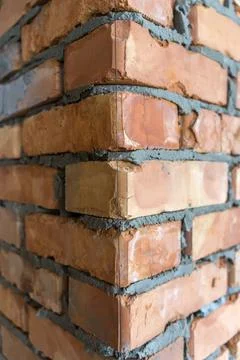 Brickwork of brick, folded in a certain way and fixed with mortar. industrial Stock Photos