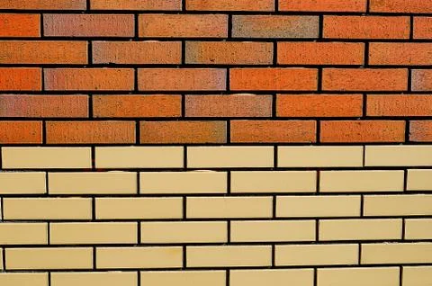 Brickwork in the construction of the house red-brown brick. 库存照片