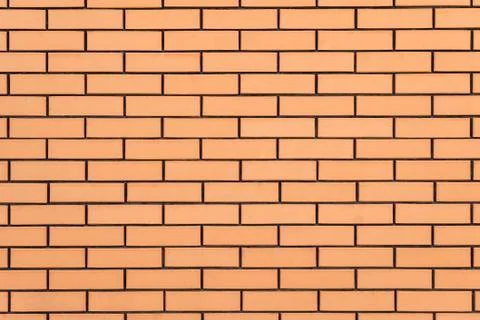 Brickwork. Facing masonry facade of ceramic bricks. Stock Photos