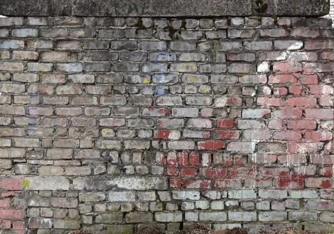 The brickwork of the old wall, uneven bricks and protruding mortar Stock Photos