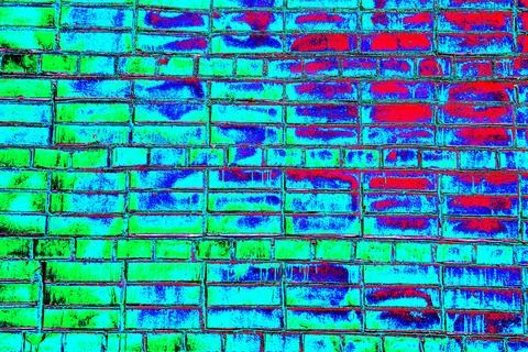 Brickwork painted with red paint, red brick background. Changed color scheme. Stock Photos