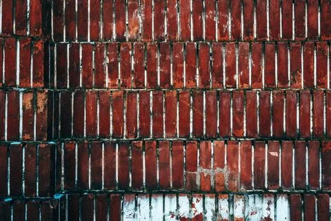 Brickwork pattern, old worn brick wall facade as background Stock Photos