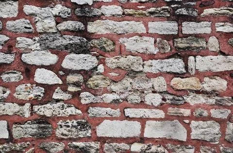 Brickwork with red cement grout. Background, texture. Stock Photos