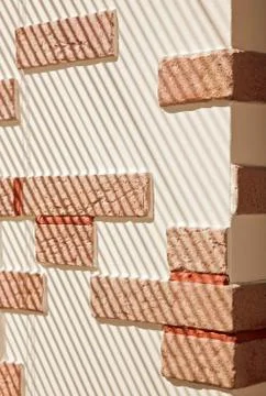 Brickwork wall striped by sunlight Stockfoto's