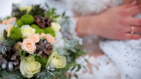 Bridal bouquet in hands in the winter. Stock Footage 106926501