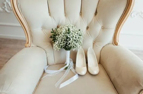 Bridal bouquet of peones with white shoes Stock Photos