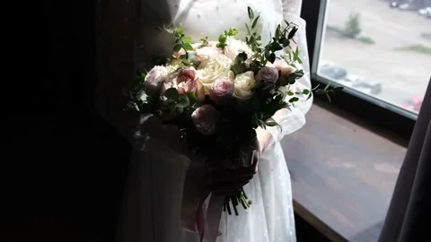 Bridal bouquet, shadow and light from the window on the flowers. Stock Footage 221261249