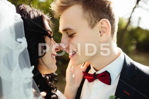 Bridal couple close to each other Stock Photos
