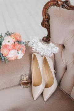 Bridal elements of an elegant classic wedding: a pair of classic beige high-h Stock Photos