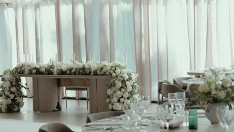 Bridal Head Table With Cascading White Roses Against Draped Curtains Stock Footage 344013462