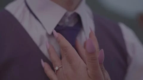 Bride Adjusting Groom’s Tie – Close-Up Engagement Detail Stock Footage 314622903