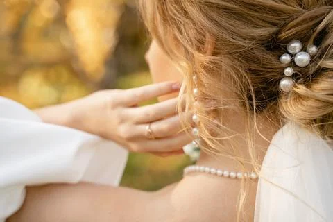 Bride adjusting her earring Stock Photos