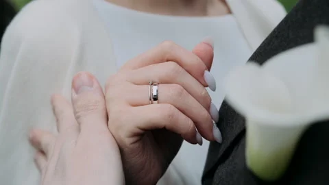 The bride adjusts the groom's jacket close-up of her hands Stock Footage 275853020