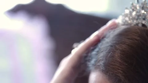 Bride adjusts her wedding crown on the head Stock-Footage 64728294