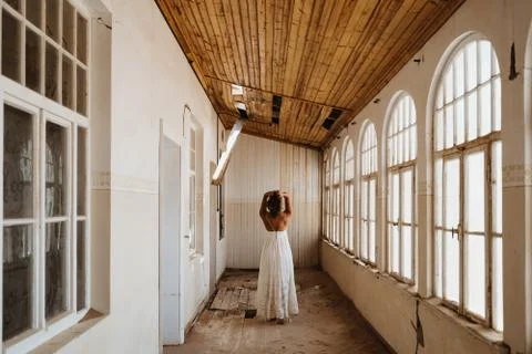 Bride after getting ready standing in an abandoned old building Stock Photos