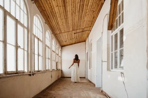 Bride after getting ready standing in an abandoned old building Stock Photos