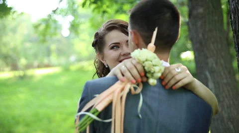 Bride and groom about tree. Clouse up Stock Footage 67980594