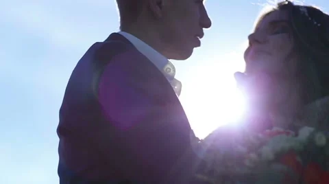 The bride and groom on the background of the sun Stock Footage 63852835