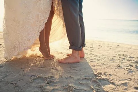Bride and groom at the beach Stock Photos