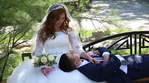 Bride and groom on the bench Stock Footage 68542912