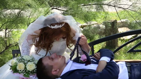 Bride and groom on the bench Stock Footage 68542923