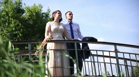 Bride and groom on the bridge. Stock Footage 67980761