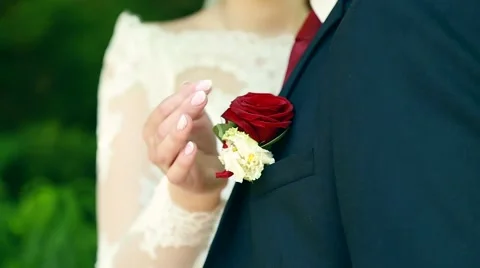 Bride and groom in bright clothes on the bench Stock Footage 65174966