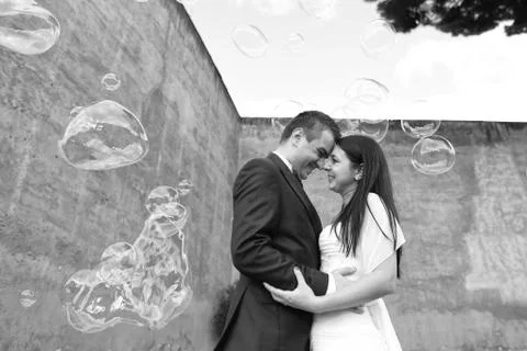 Bride and groom with bubbles soap Stock Photos