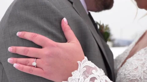 Bride and Groom Close Up on Hand with Wedding Rings in Winter Stock Footage 148695576