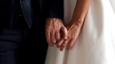 Bride and groom crossing hands Stock Footage