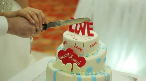 The bride and groom cut the cake Stock Footage 46995895