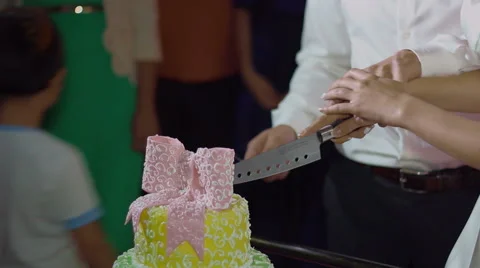 The bride and groom cut the cake Stock Footage 61122175