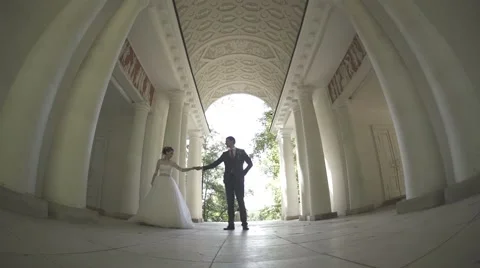 Bride and groom dancing in the arch Stock Footage 59855299