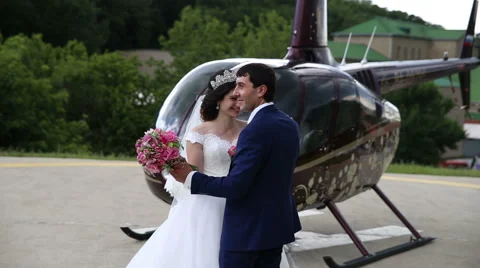 Bride and groom dancing on the background of helicopter Stock Footage 68904551