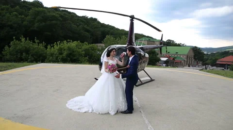 Bride and groom dancing on the background of helicopter Stock Footage 68904553