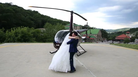 Bride and groom dancing on the background of helicopter Stock Footage 68904579