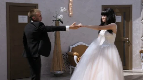 Bride and groom dancing on the background of beautiful architecture Stock Footage 106349806