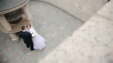 Bride and groom dancing in the beautiful park Stock Footage 62438754