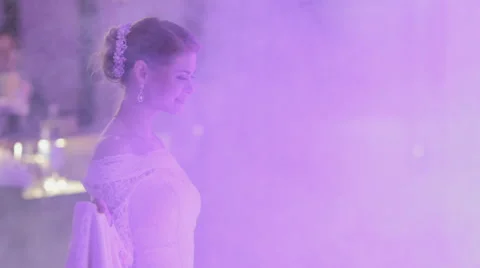 Bride and groom dancing their first wedding dance in a smoke Stock Footage 47808561