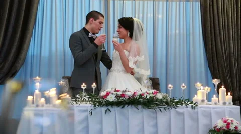 Bride and groom drinking champain at wedding recieption Stock Footage 67993552