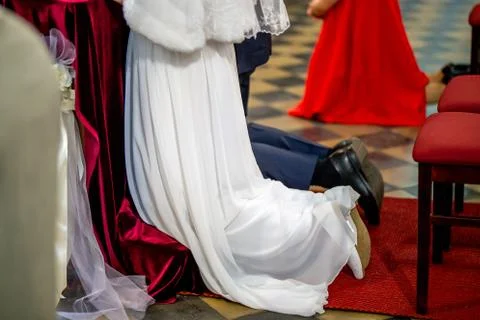 Bride and groom during wedding ceremony in church. Stock Photos
