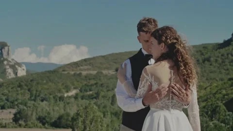 The Bride and Groom Embrace. Expression of Affection in Their Poses. Natural Stock Footage 170062944