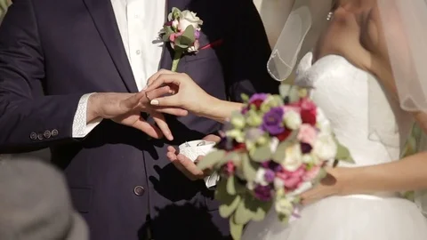 Bride and groom exchanging wedding rings Stock Footage 74058762
