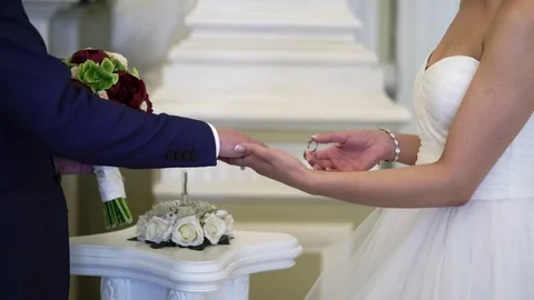Bride and groom exchanging wedding rings Stock Footage 79611062